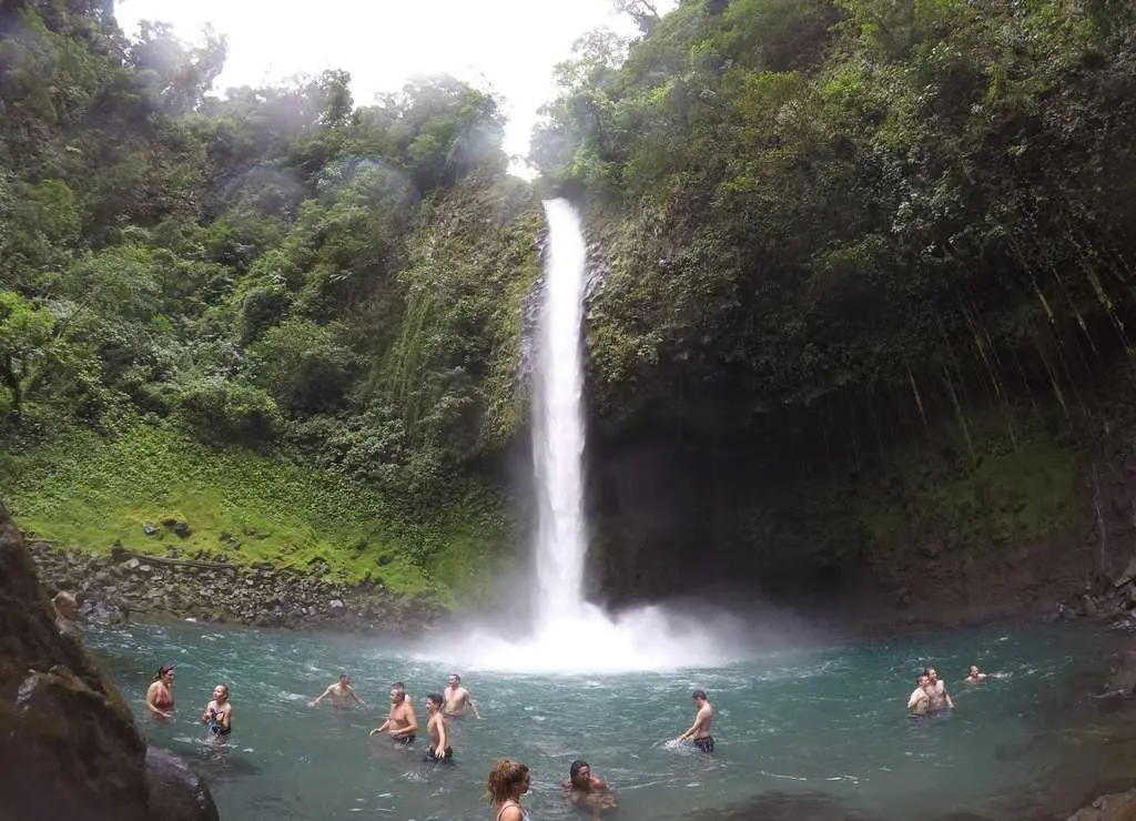 Waterfall surrounded by tropical vegetation in La Fortuna